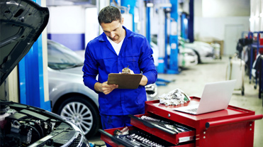 Mechanic at work on car