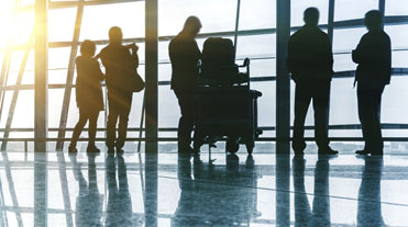 Group of people by a large window