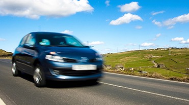 Car driving down a road