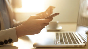 Person at a desk on their phone